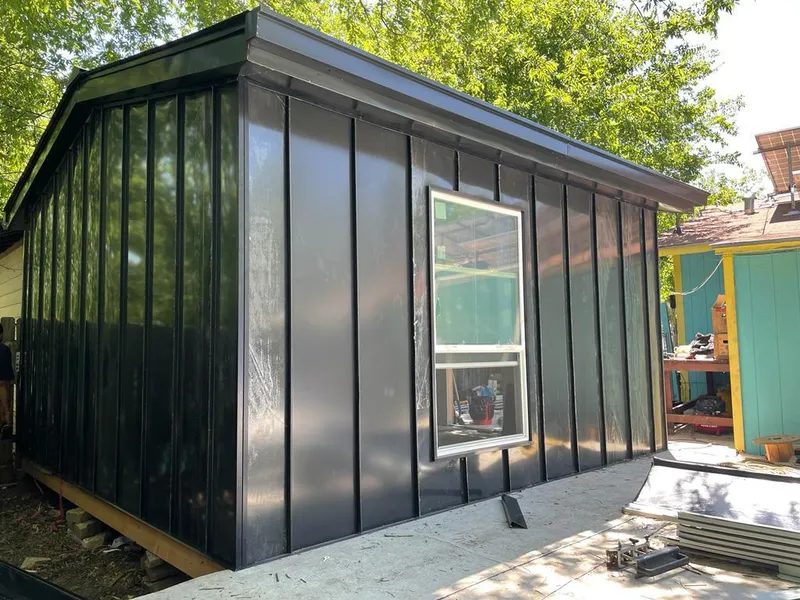 Black standing seam metal wall panels for Roof Inspection in Castaic